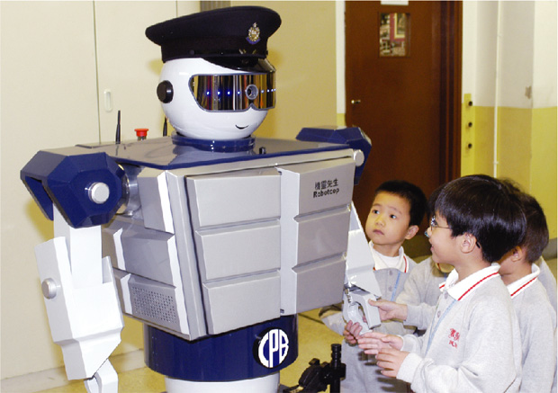 A Robotcop teaches kindergarten pupils about civic responsibilities.