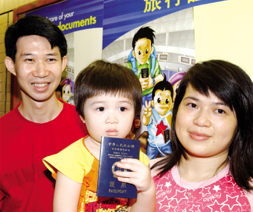 Tiny three-year-old Wong Wing-chi is the three-millionth person to receive a Hong Kong Special Administrative Region passport.